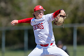 Baseball player pitching the ball.