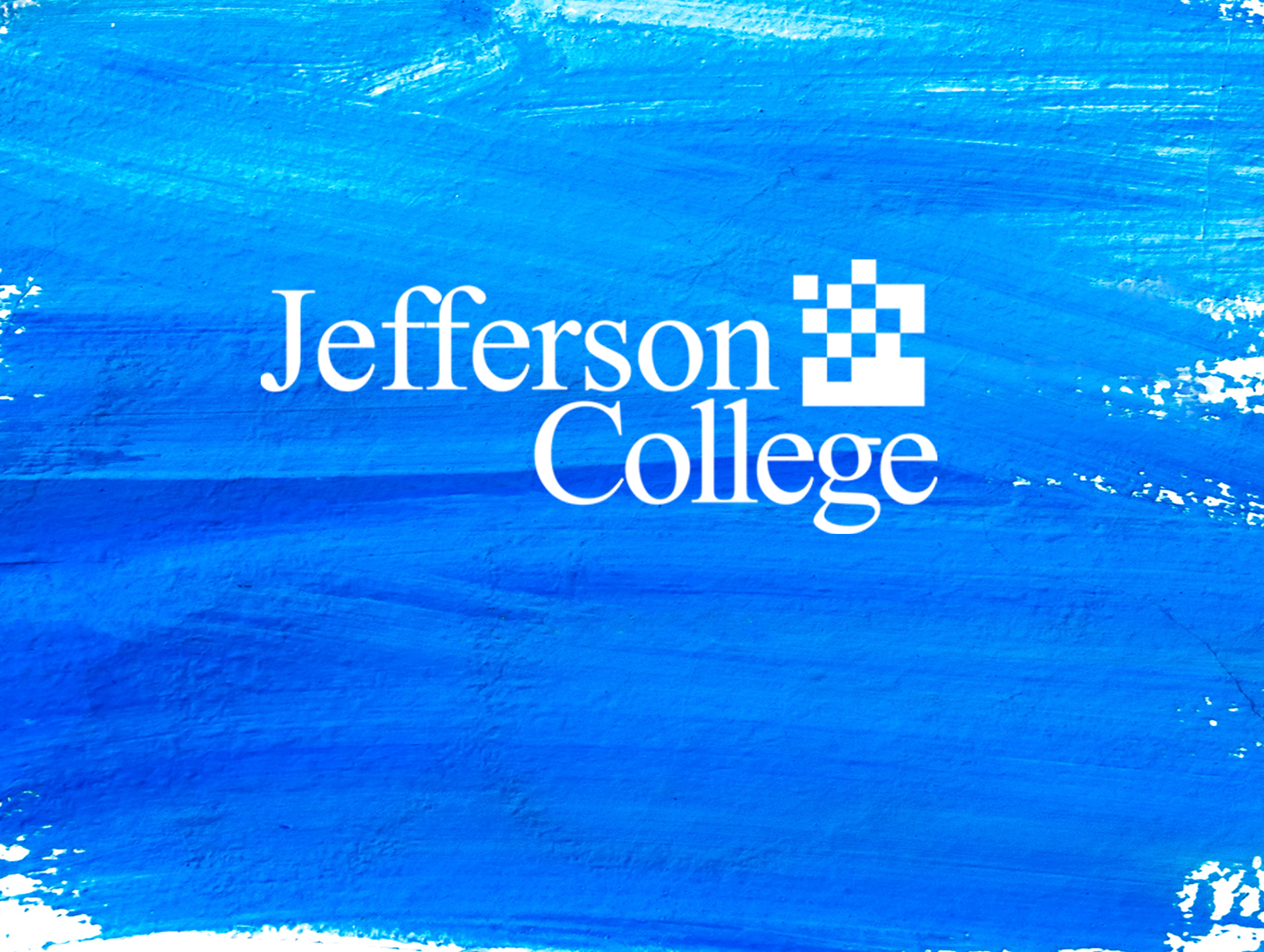 Jefferson College Logo on Blue Paint Background