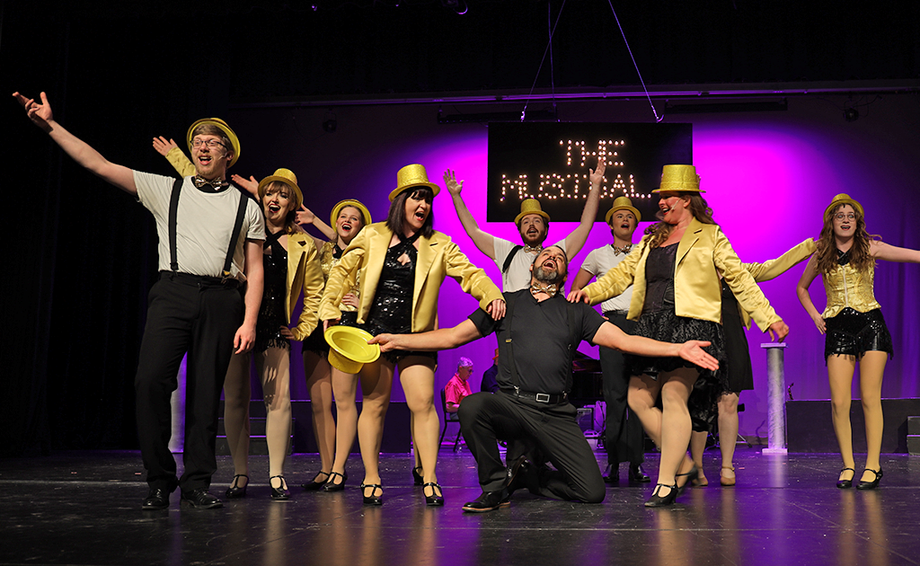 Performers on stage for musical.