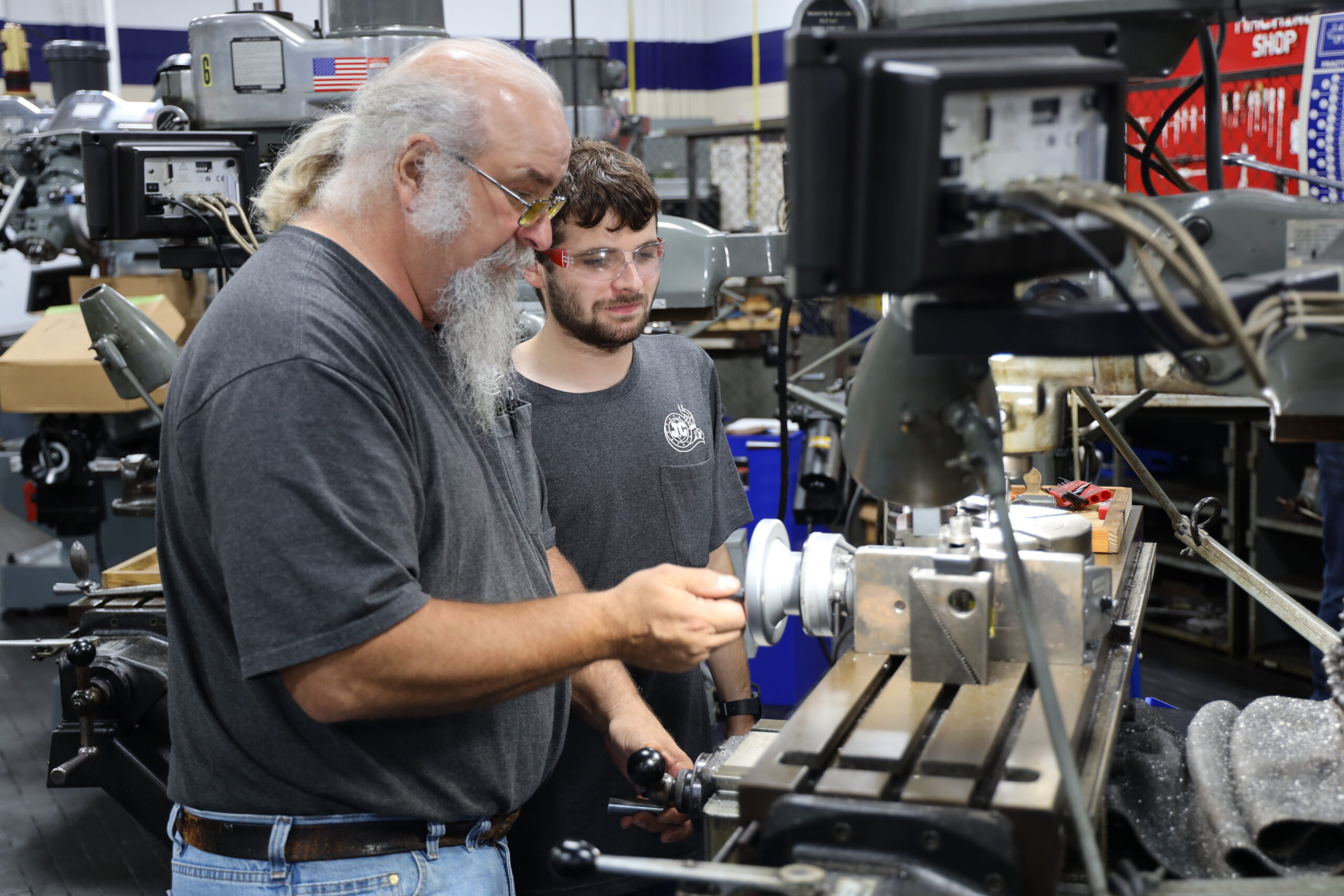 Student in PMT class working with instructor.