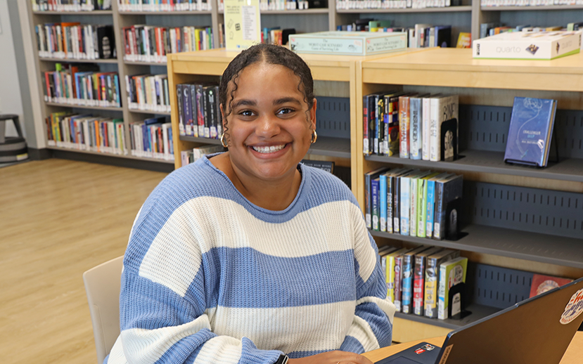 Student studying in Library.