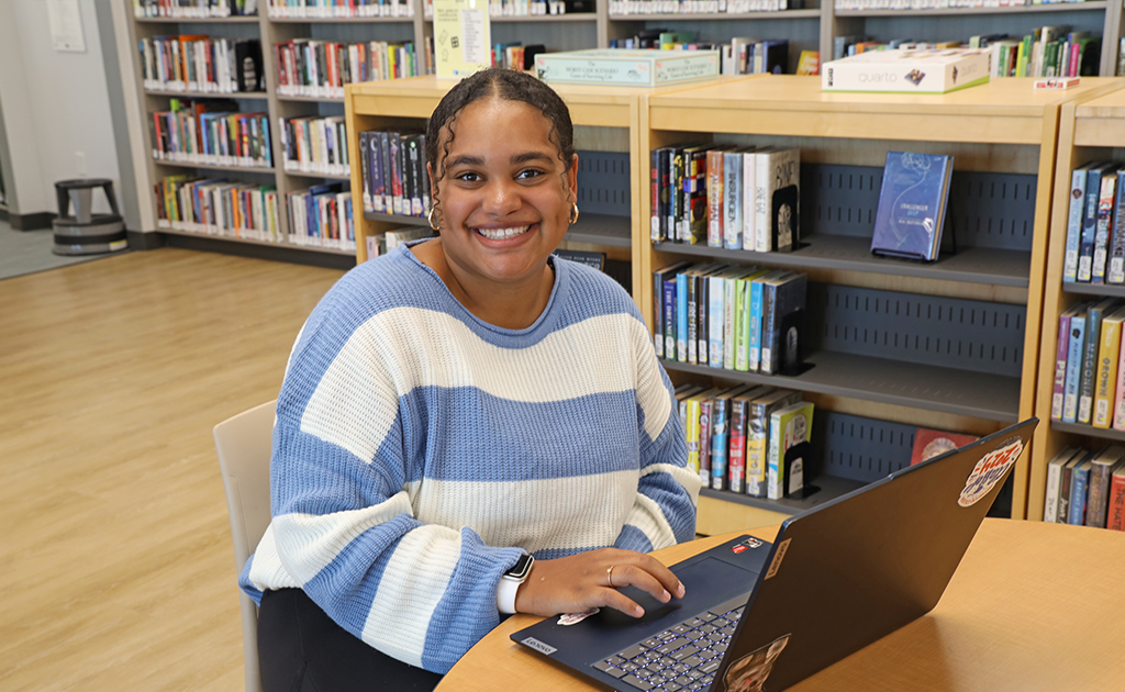 Student studying in Library.