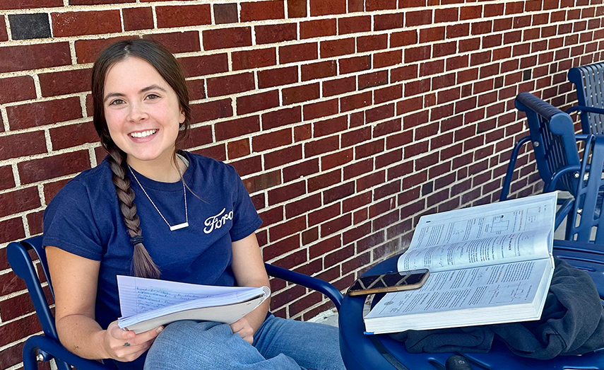 Student studying outside.