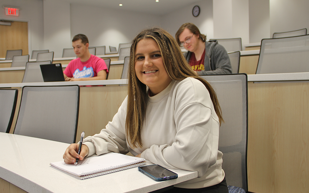 Student sitting in classroom.