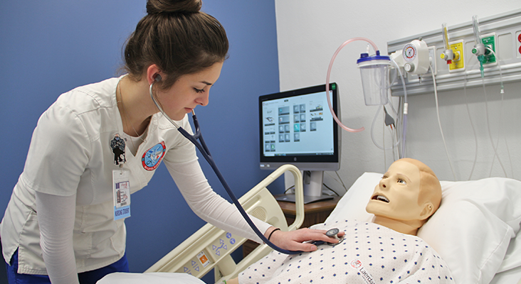 Nursing student in lab.