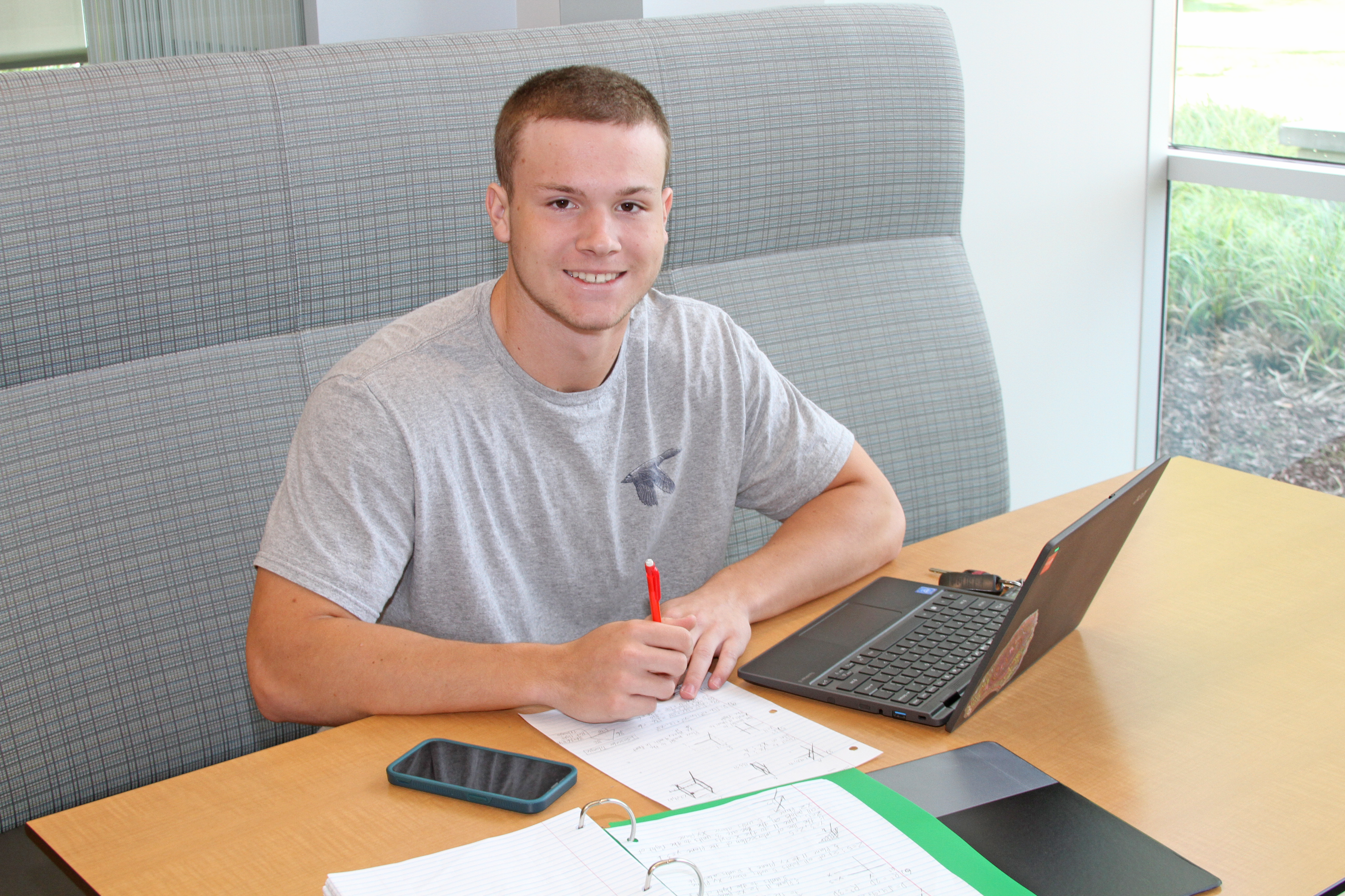 student in library